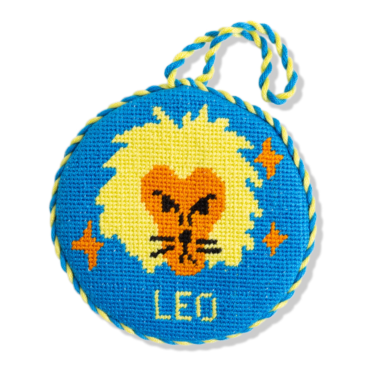 Circular toy with a lion design and 'Leo' text on a blue background