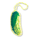 Green and yellow dog toy with a handle on a white background