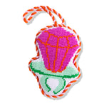 Colorful dog toy with pink center, green base, and orange rope on a white background