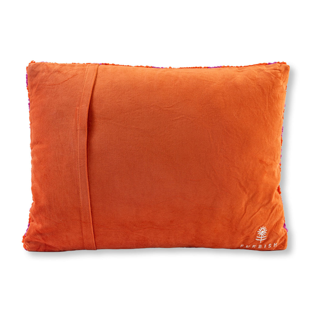 Orange pillow with a brand logo on a white background