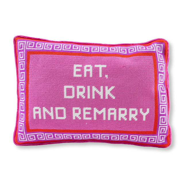 Pink pillow with 'Eat, Drink and Remarry' text on a white background