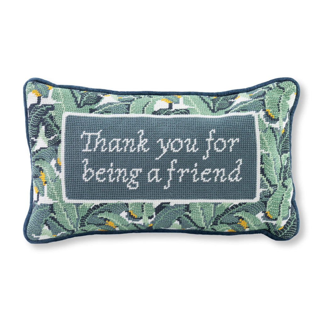 Decorative pillow with floral pattern and 'Thank you for being a friend' text on a white background