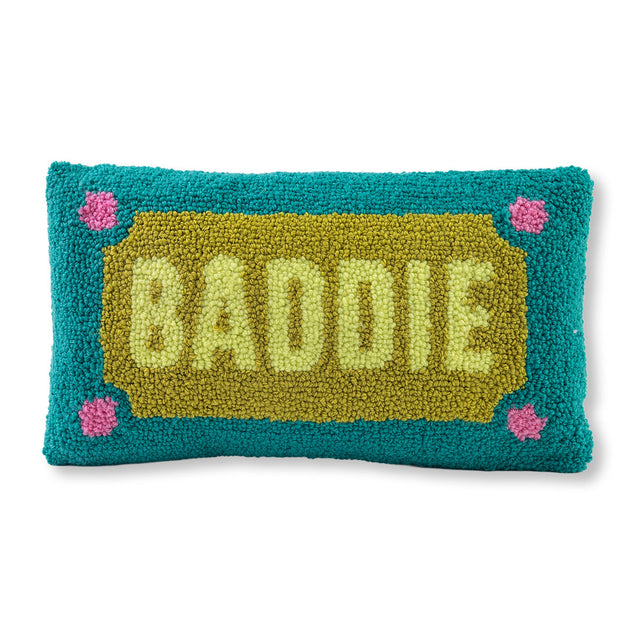 Pillow with 'BADDIE' text on a teal background