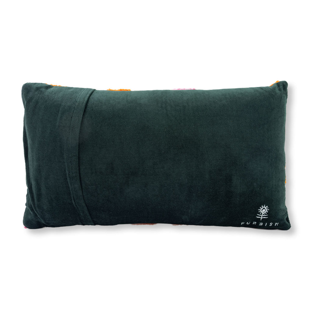 Green pillow with a brand logo on a white background