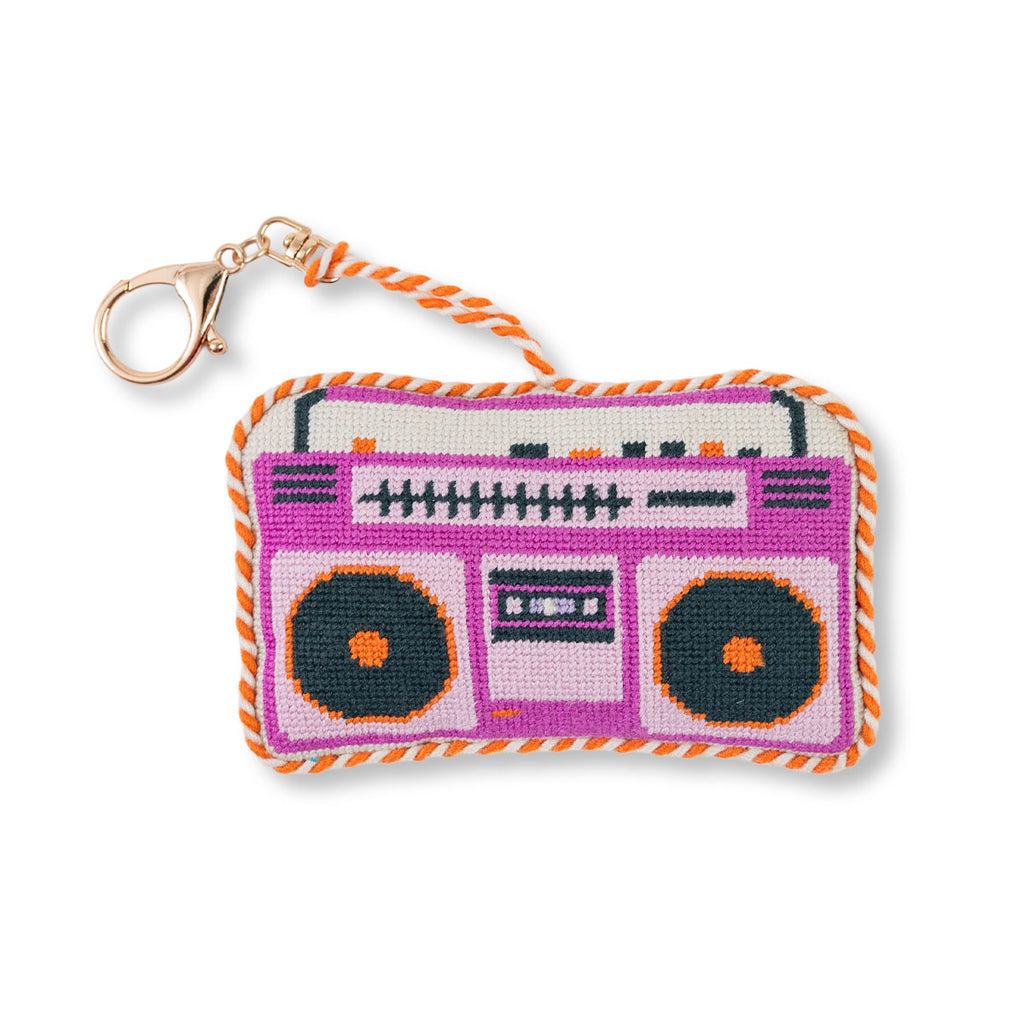 Keychain with needlepoint design of a boombox on a white background