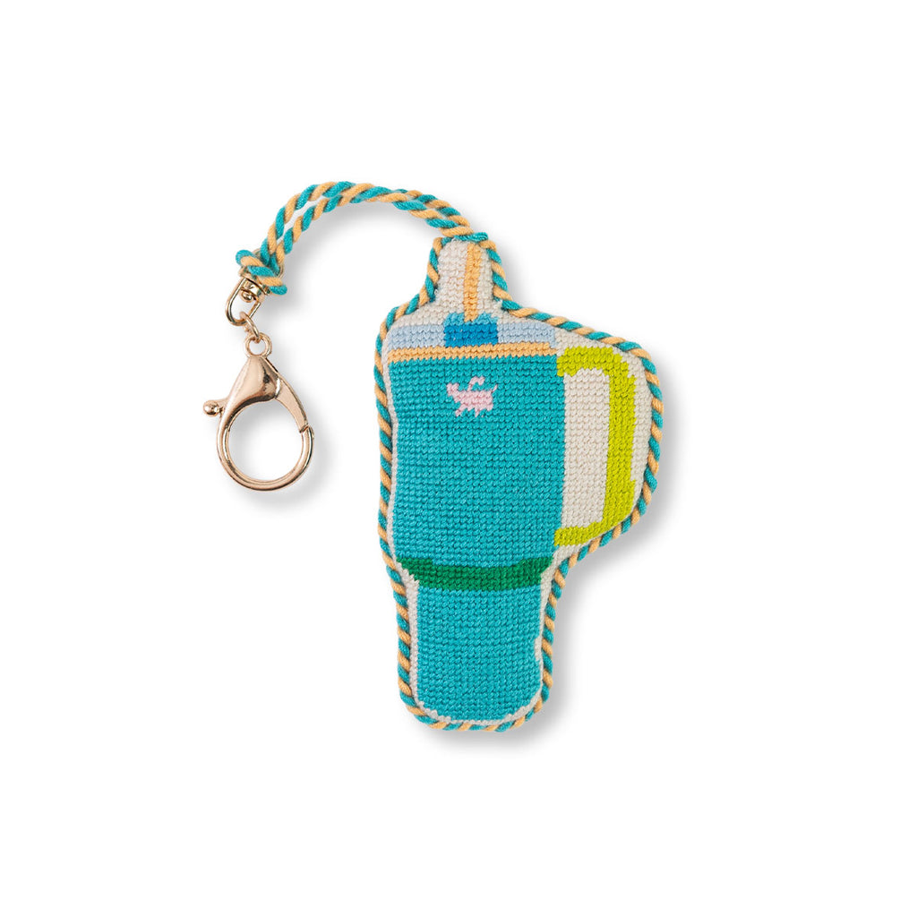 Knitted flip-flop keychain with colorful details on a white background