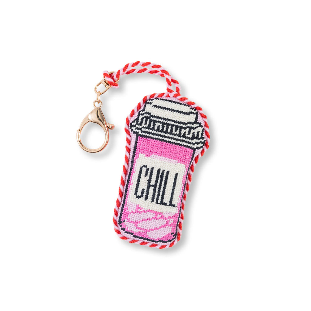 Keychain with a pink and white design and 'CHILL' text on a white background