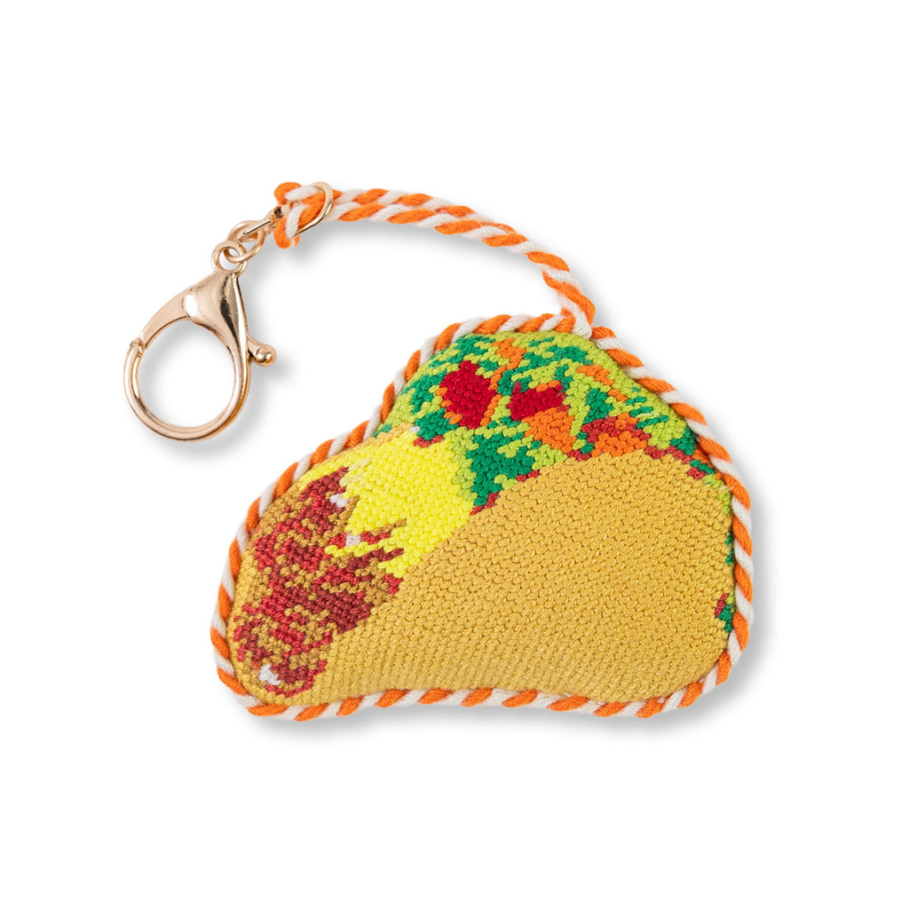 Colorful taco-shaped keychain with a white background