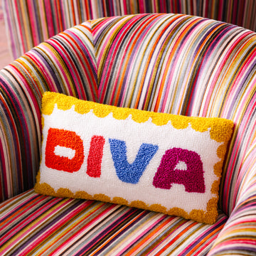 Colorful striped chair with a 'DIVA' pillow