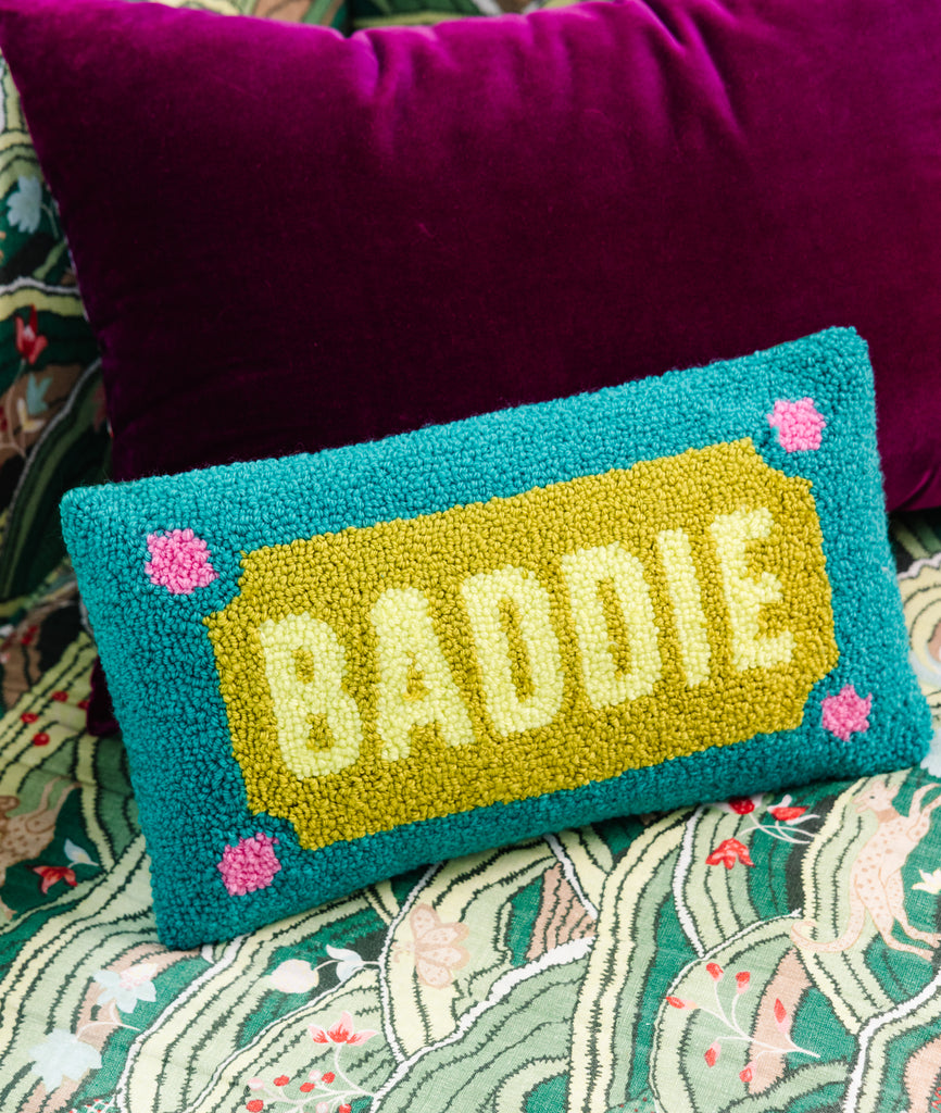 Pillow with 'BADDIE' on a colorful background