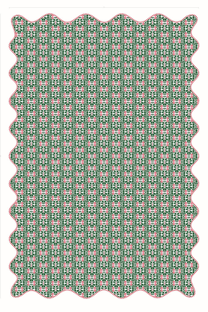 Green and pink patterned doily on a white background