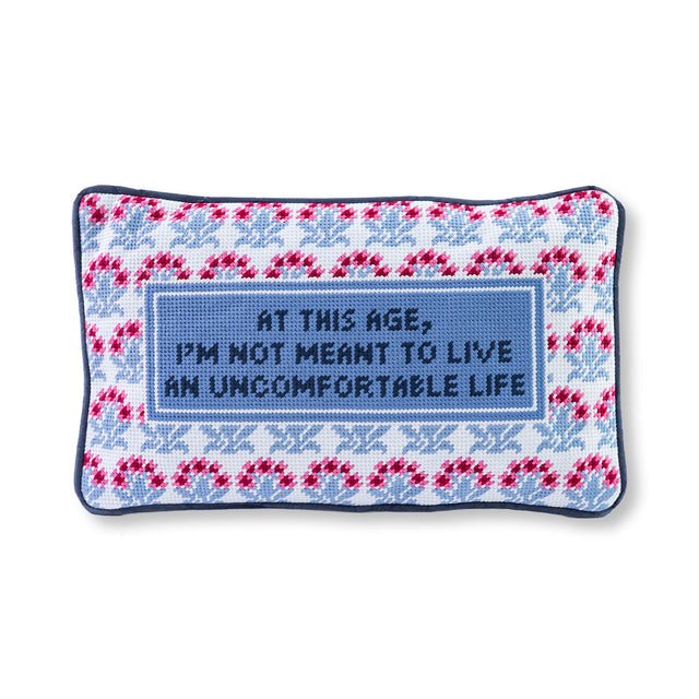 Decorative pillow with text and pattern on a white background