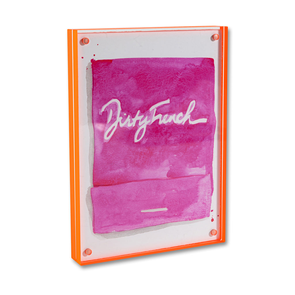 Dirty French Matchbook - Furbish Studio, A matchbook watercolor print with a white painted "Dirty French" title and a dark pink background paint enclosed in a 5" x 7" orange magnetic acrylic floating frame facing a side view