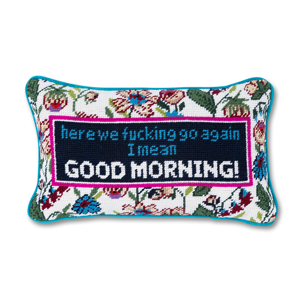 hand embroidered in wool and backed in luxe blue green velvet chic needlepoint pillow with "here we fucking go again, I mean Good morning!" cheeky saying in front 
