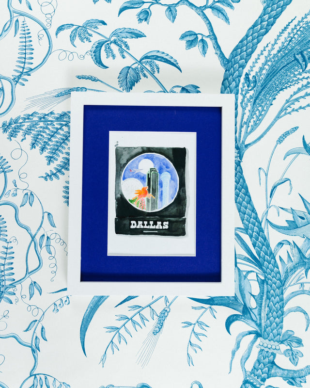 Dallas Matchbook - Furbish Studio, A matchbook watercolor print illustrating Dallas surroundings and the Reunion tower with a black paint background in a 5x7 white frame with a wallpaper background