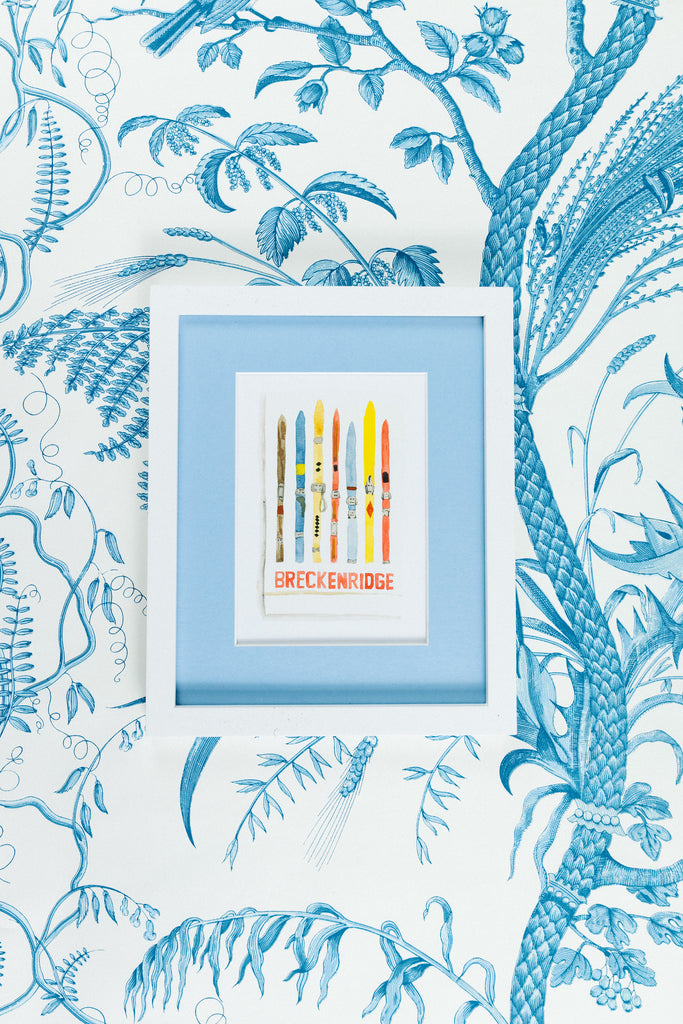 Breckenridge Matchbook - Furbish Studio, A Breckenridge Matchbook watercolor print featuring multiple colorful Ski boards arranged vertically  and is in a 5x7 white frame with a wallpaper background