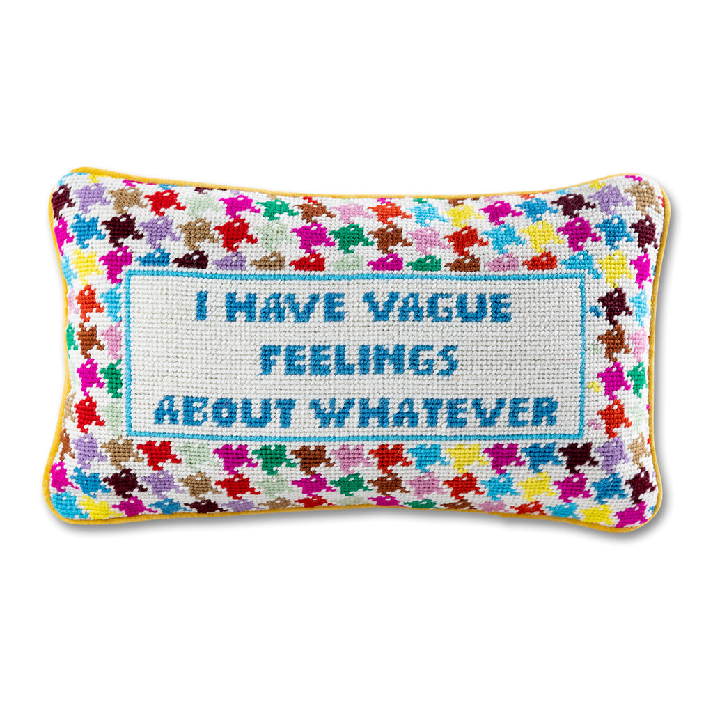 front view of the luxe yellow velvet chic hand needlepoint pillow with "I have vague feelings about whatever" saying written in blue surrounded by colorful patterns