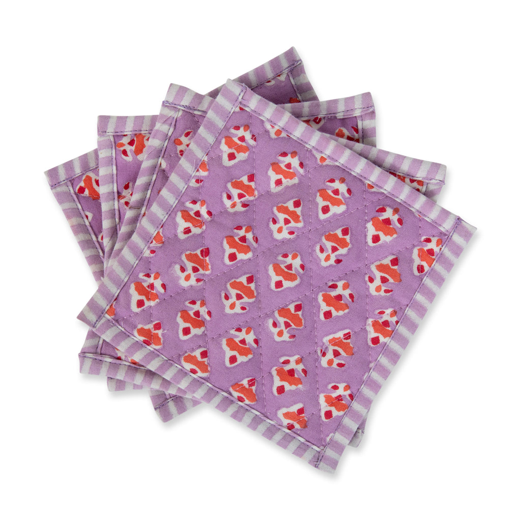 four lilac block print handmade coasters with orange flowers and straight edge stripes