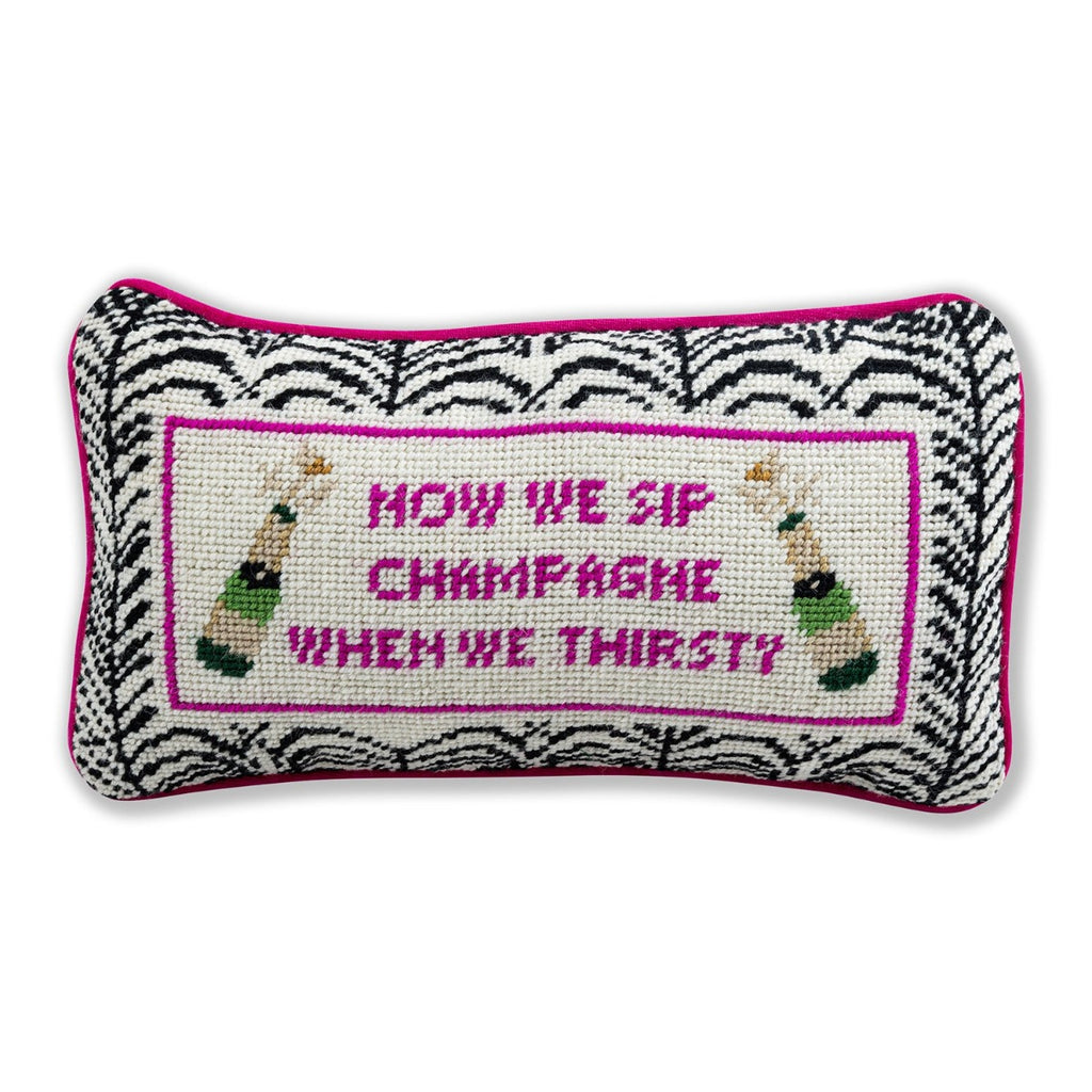 a closer look at the luxe rose velvet chic hand needlepoint pillow with "Now we sip champagne when we thirsty" saying in front