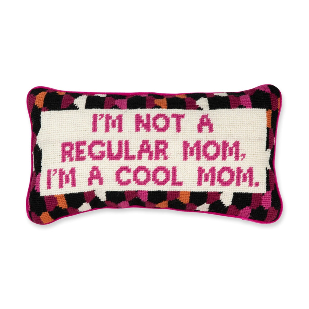an in-depth view of a luxe hot pink chic hand needlepoint pillow with "I'm not a regular mom, I'm a cool mom" saying in front