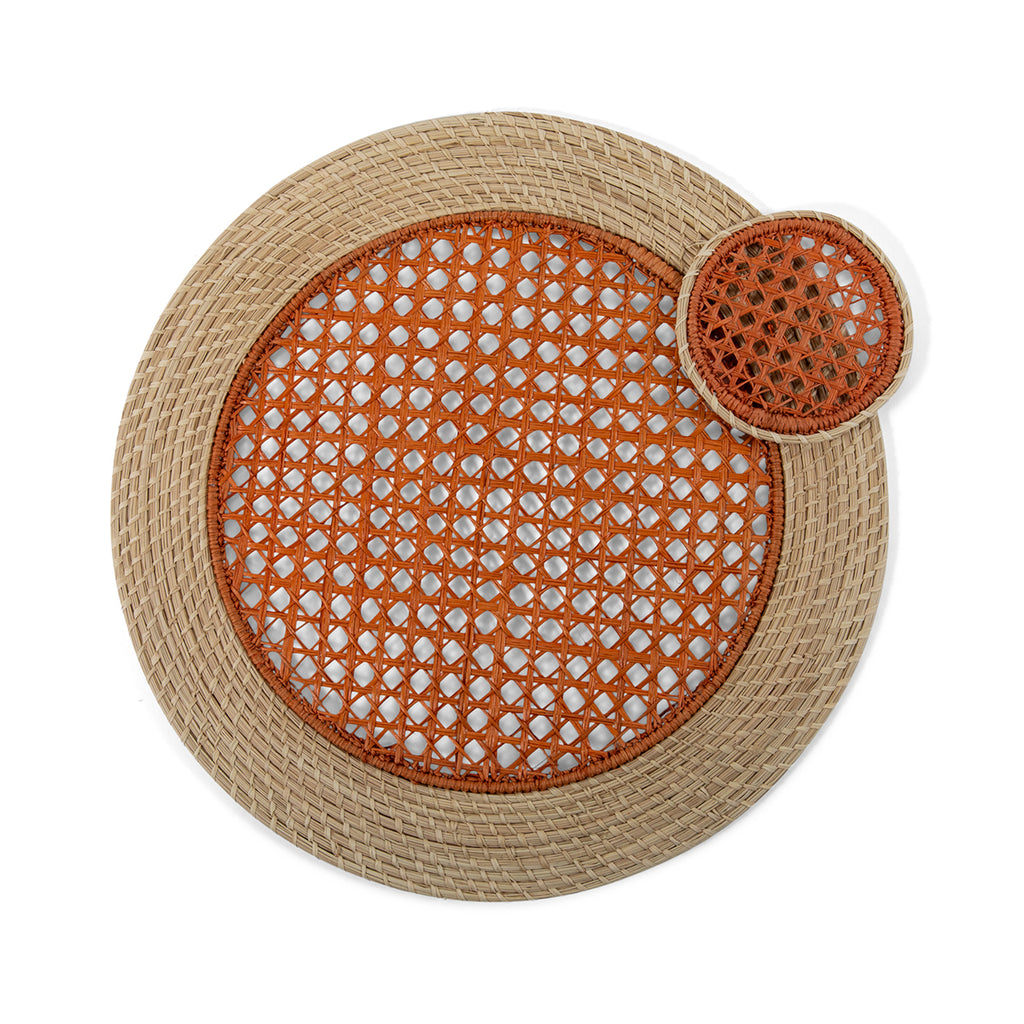 Furbish Studio - Orange Raffia Placemat and Coaster - Add fresh charm to your spring and summer table setting or picnic with this set of 4 handmade, orange raffia placemats. Show off your hostess skills by creating a gorgeous tablescape using this eye-catching table accessory. Made of all natural raffia fibers with a pink woven center design and neutral raffia coiled edge.