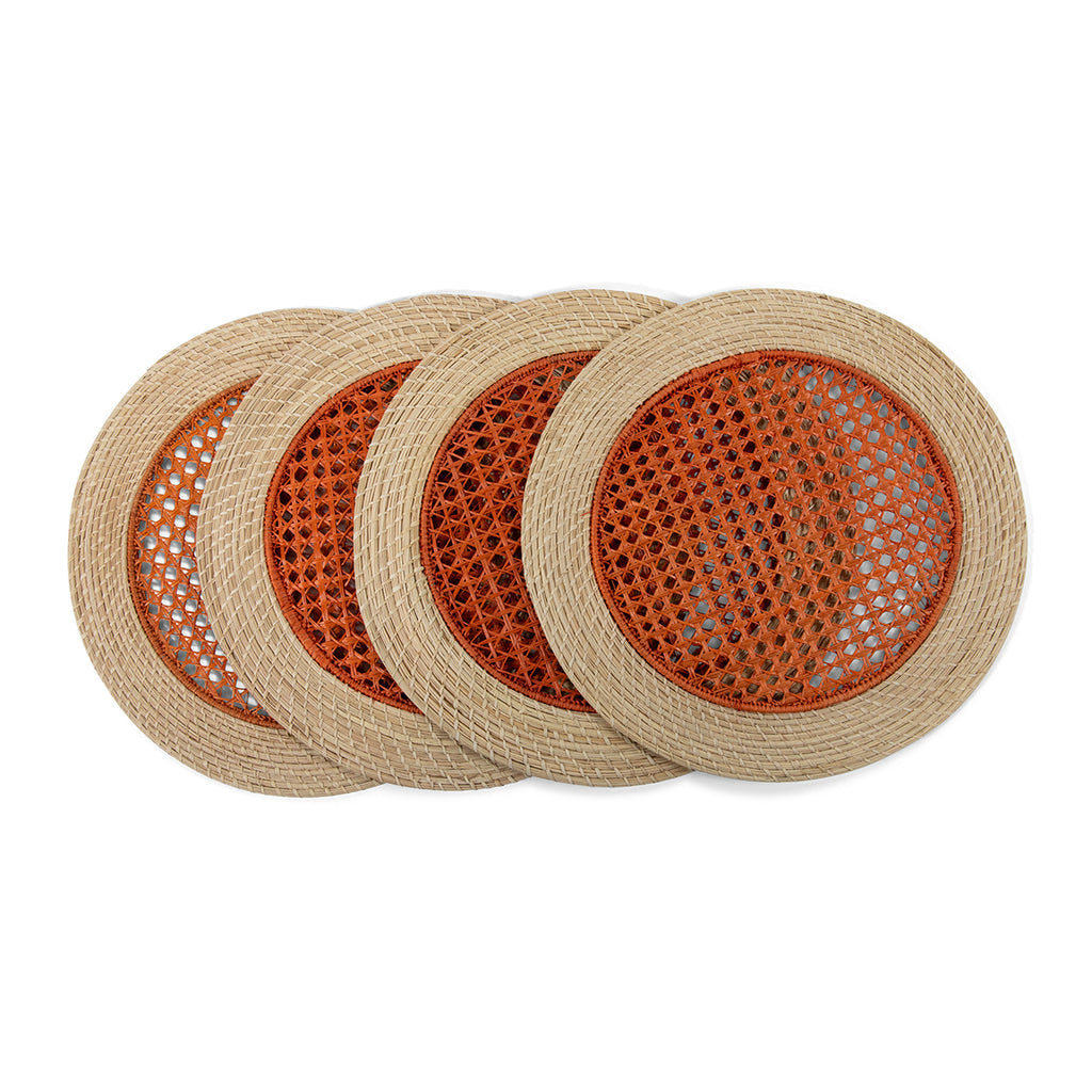 Furbish Studio - Orange Raffia Placemats - Add fresh charm to your spring and summer table setting or picnic with this set of 4 handmade, orange raffia placemats. Show off your hostess skills by creating a gorgeous tablescape using this eye-catching table accessory. Made of all natural raffia fibers with a pink woven center design and neutral raffia coiled edge.