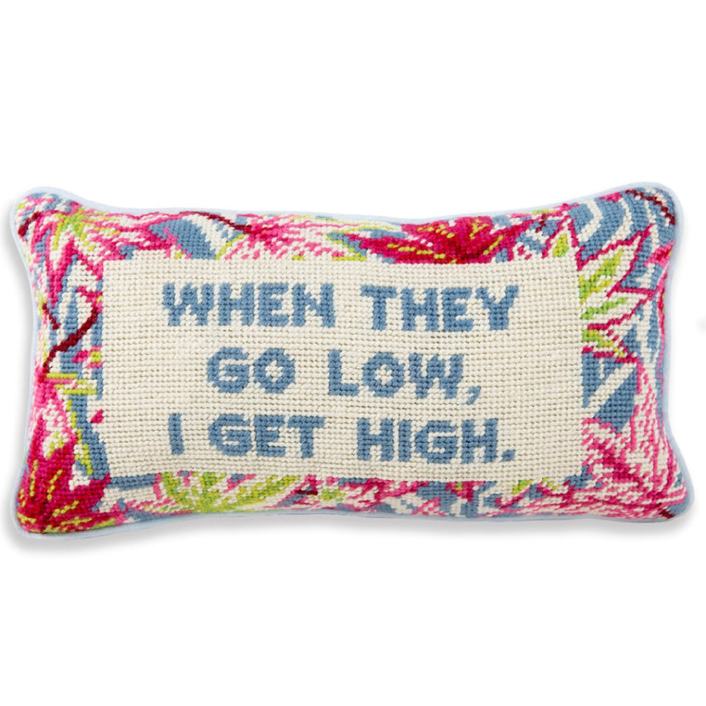 a closer look of a hand embroidered in wool and backed in luxe light blue velvet chic needlepoint pillow with "When they go low, I get high" cheeky saying in front 
